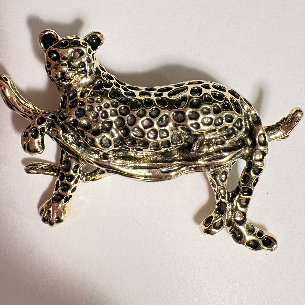 Gold tone Leopard resting on a branch brooch